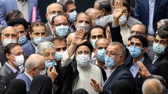 President Ebrahim Raisi surrpunded with triumphant conservatives in parliament during his inauguration in August 2021