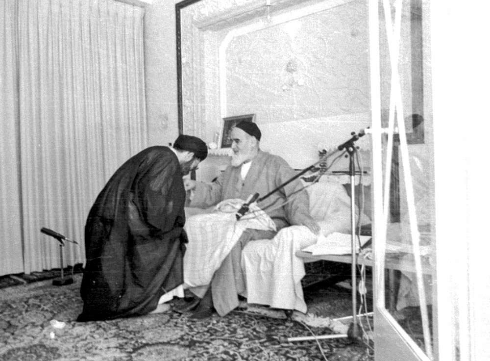 Ali Khamenei kisses the hand of Ruhollah Khomeini, the founder of the Islamic Republic, in an undated image. 