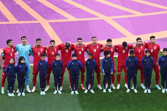 Iranian players line up during the national anthems before the match against England on November 21, 2022.