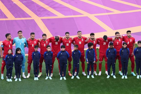 Iranian players line up during the national anthems before the match against England on November 21, 2022.
