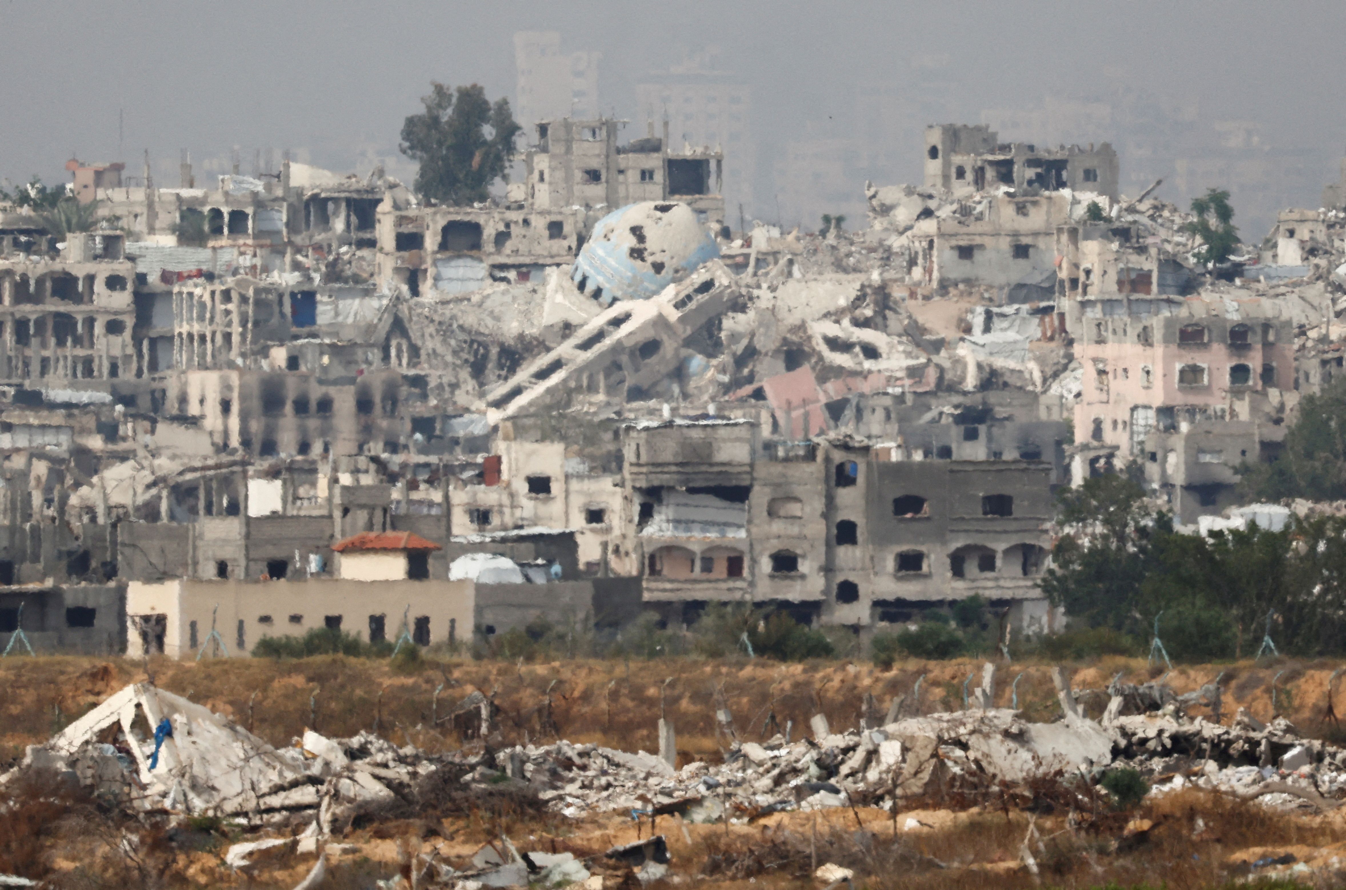 A general view of destruction in North Gaza, as seen from the Israeli side of the Israel-Gaza border, May 17, 2025. 
