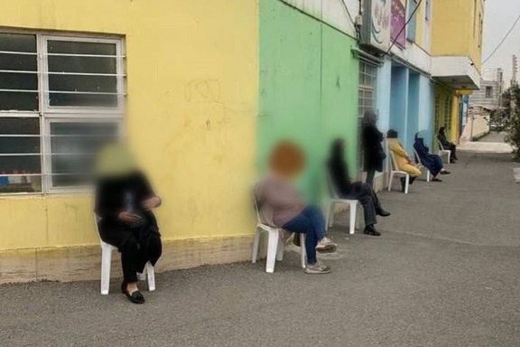 Parents standing guard around their children’s school in the city of Zanjan
