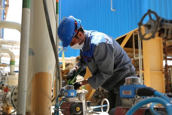 Worker at an Iranian oil refinery