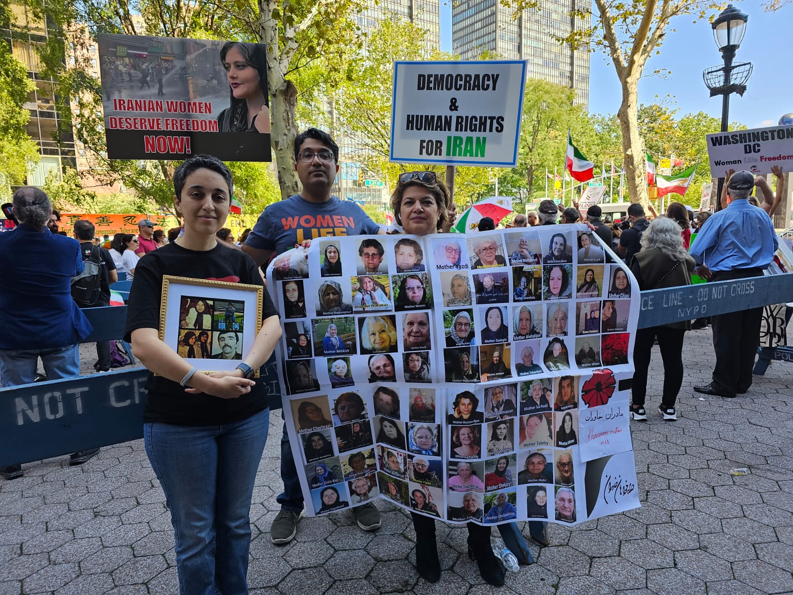 Hamid Charkhkar, with his wife (L) and another activist outside the UN in New York