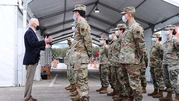 President Joe Biden with US troops in February 2021