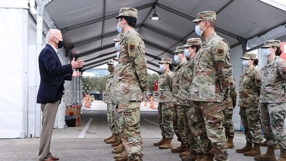 President Joe Biden with US troops in February 2021