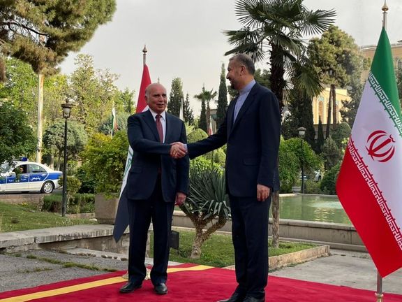 Iraqi Foreign Minister Fuad Hussein (left) and his Iranian counterpart Hossein Amir-Abdollahian in Tehran