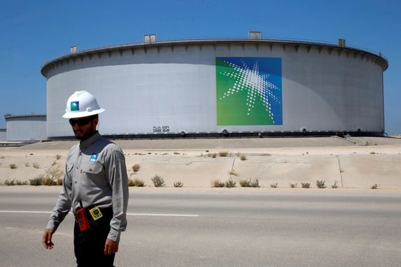 An Aramco employee walks near an oil tank at Saudi Aramco's Ras Tanura oil refinery and oil terminal in Saudi Arabia May 21, 2018.