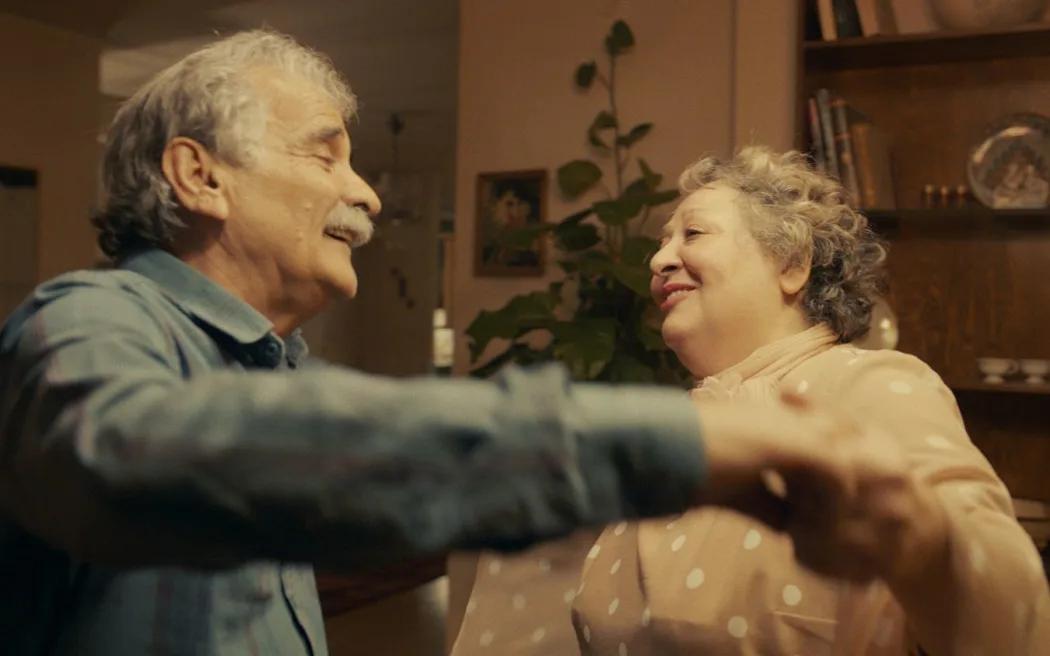 Esmaeil Mehrabi and Lily Farhadpour dancing together in a scene from the movie My Favorite Cake.