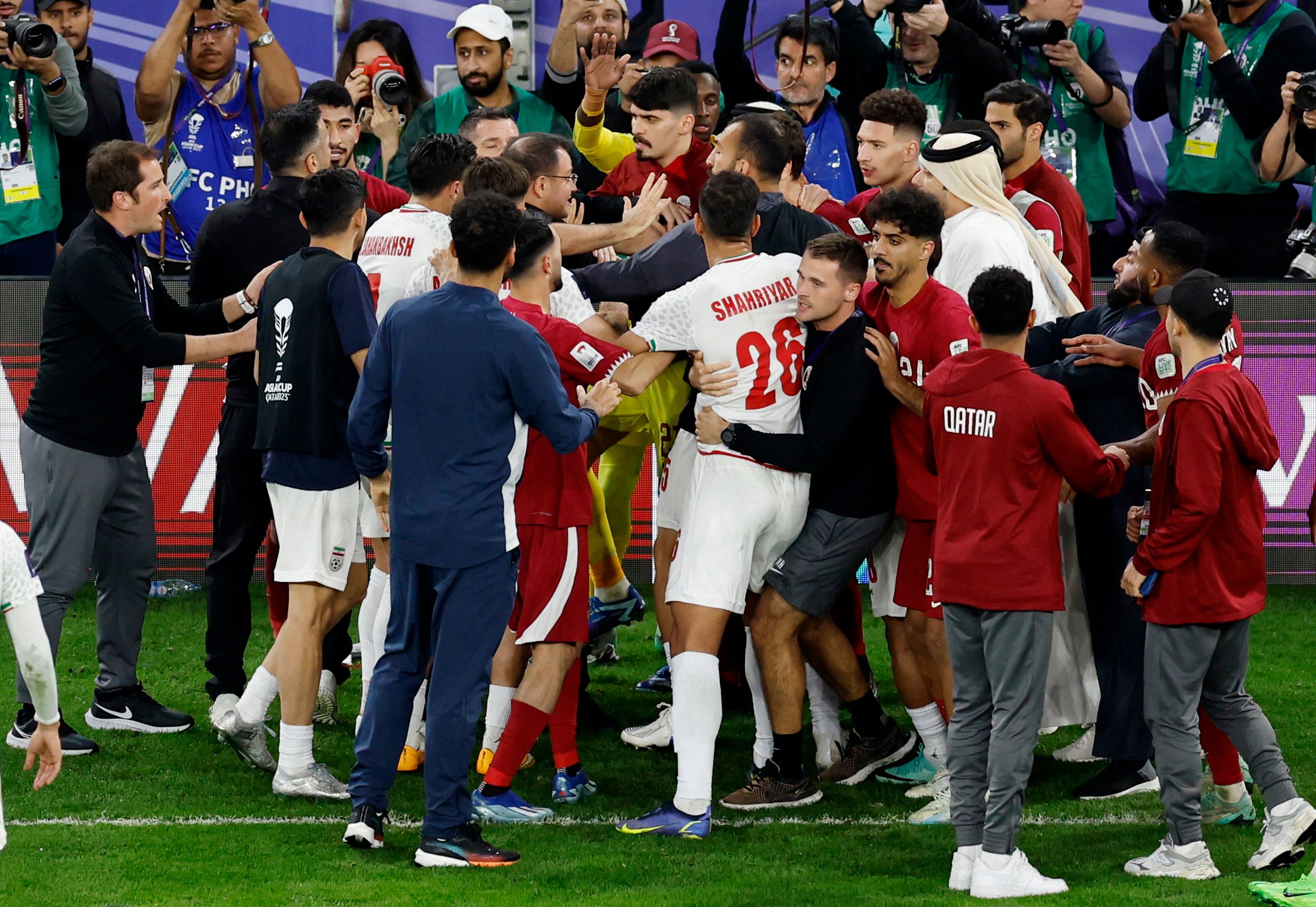 Iran and Qatar players clash after their semifinal match in Doha, Qatar - February 7, 2024. Iran lost the game 3-2.  