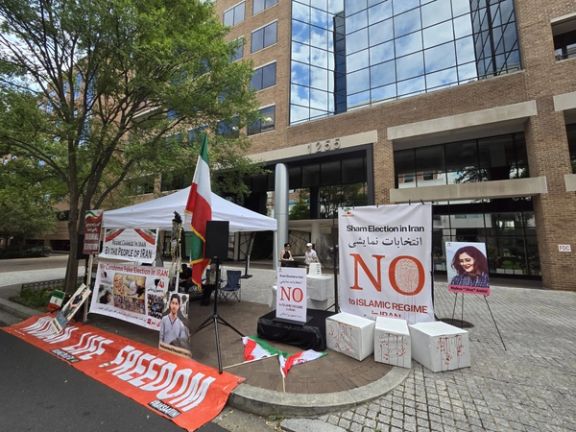 Iranian dissidents attend a protest gathering organized by the National Solidarity Group of Iran outside a polling station at the Islamic Republic's Interests Section in Washington DC on June 28, 2024.