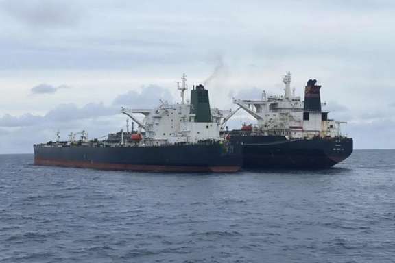 An undated photo showing a ship-to-ship oil transfer