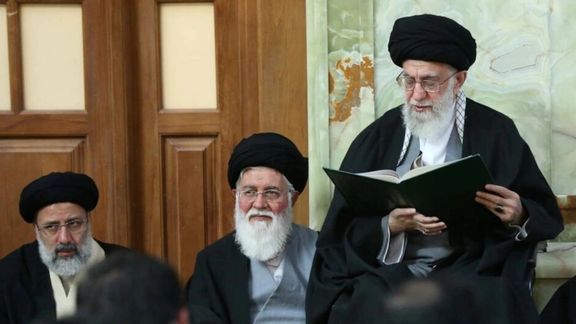 Ahmad Alamolhoda (C) next to Khamnei and President Raisi in a ceremony. Undated