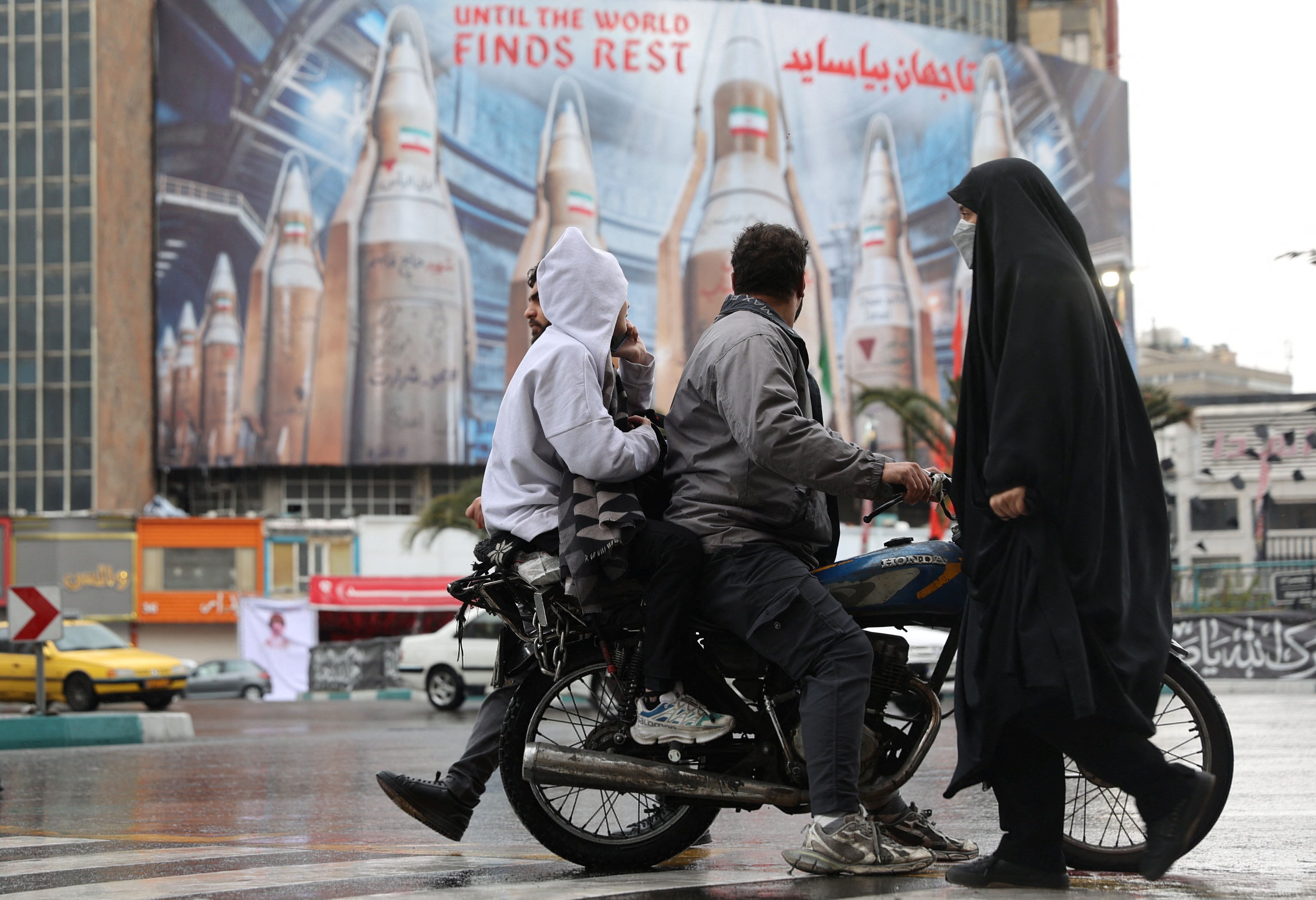 A billboard displays images of Iranian missiles, amid the US-Israeli conflict with Iran, in Tehran, Iran, March 16, 2026. 