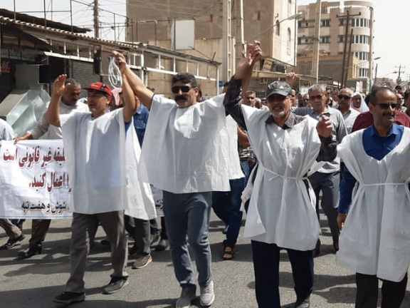 Protesters in Iran wearing white shrouds as a sign of readiness to die. July 2, 2022