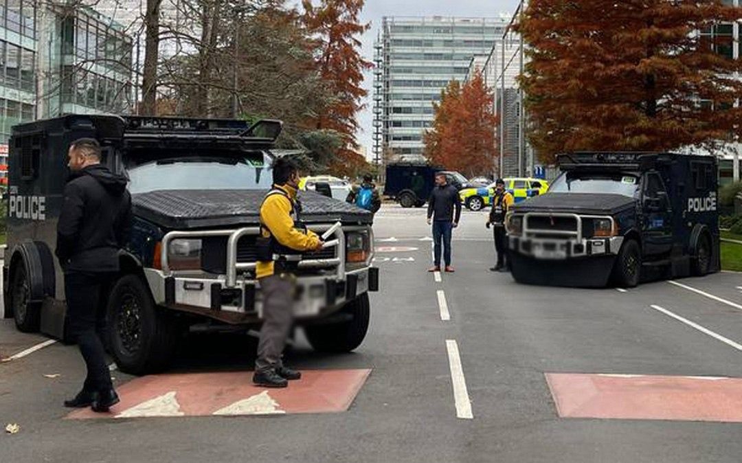 Armored police vehicles are seen outside the headquarters of Iran International on Nov. 19, 2022
