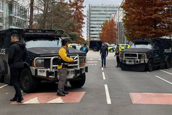 Armored police vehicles are seen outside the headquarters of Iran International on Nov. 19, 2022