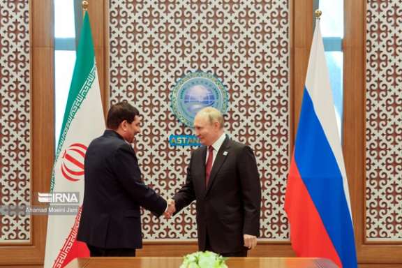 Russian president Vladimir Putin shaking hands with Iran's acting president Mohammad Mokhber July 4, 2024.