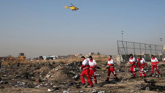 Rescue team works among debris of a plane belonging to Ukraine International Airlines, that crashed after take-off from Iran's Imam Khomeini airport, on the outskirts of Tehran, Iran January 8, 2020.