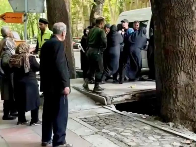 A woman being arrested by hijab police in Tehran on May 7