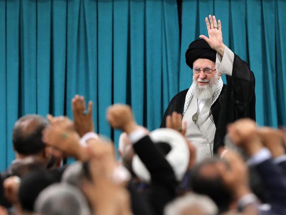 Iran's supreme leader Ali Khamenei waves at members of parliament, Tehran, Iran, June 11, 2025