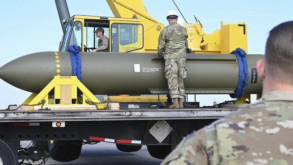Airmen inspect a Massive Ordnance Penetrator bomb at Whiteman Air Base in Missouri in a photo released by the US Air Force.