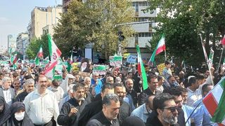 Tehran Stages A Crowd As Officials Threaten Protesters