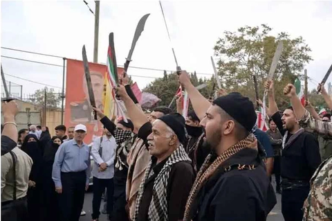 Machete-wielding men at IRGC-backed rally revive scrutiny of crackdowns