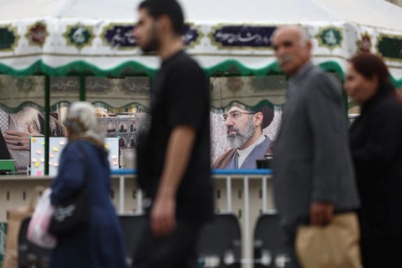 eople walk past a banner with a picture of Iran's Supreme Leader, Mojtaba Khamenei, in Tehran Bazaar, in Tehran, Iran, May 16, 2026.