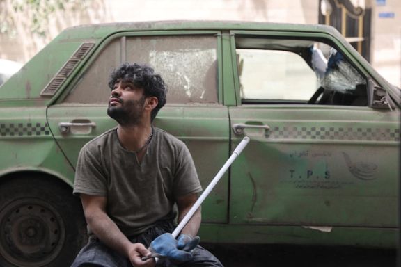 A man looks on as he works following an Israeli strike on a building on Monday, after the ceasefire between Israel and Iran, in Tehran, Iran, June 26, 2025.