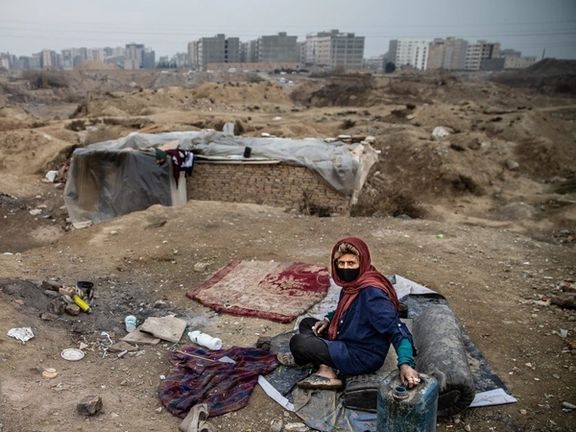 A poor woman living on the outskirts of Tehran without shelter