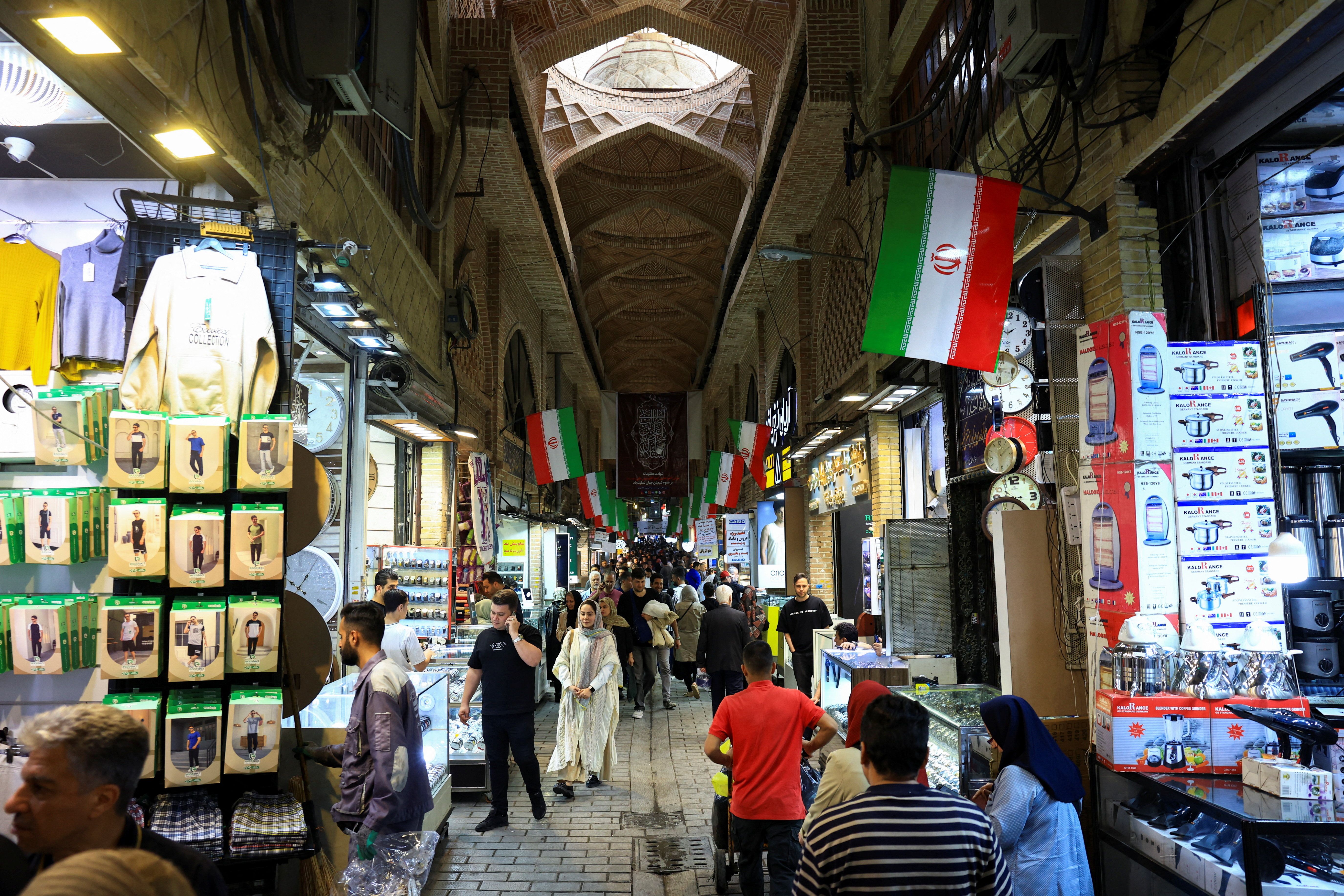 Shoppers walk through Tehran's Grand Bazaar in Tehran, Iran, April 13, 2026.