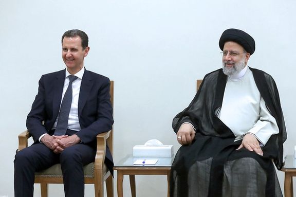 Syrian President Bashar Assad (left) and his Iranian counterpart Ebrahim Raisi during a meeting in Tehran on May 8, 2022