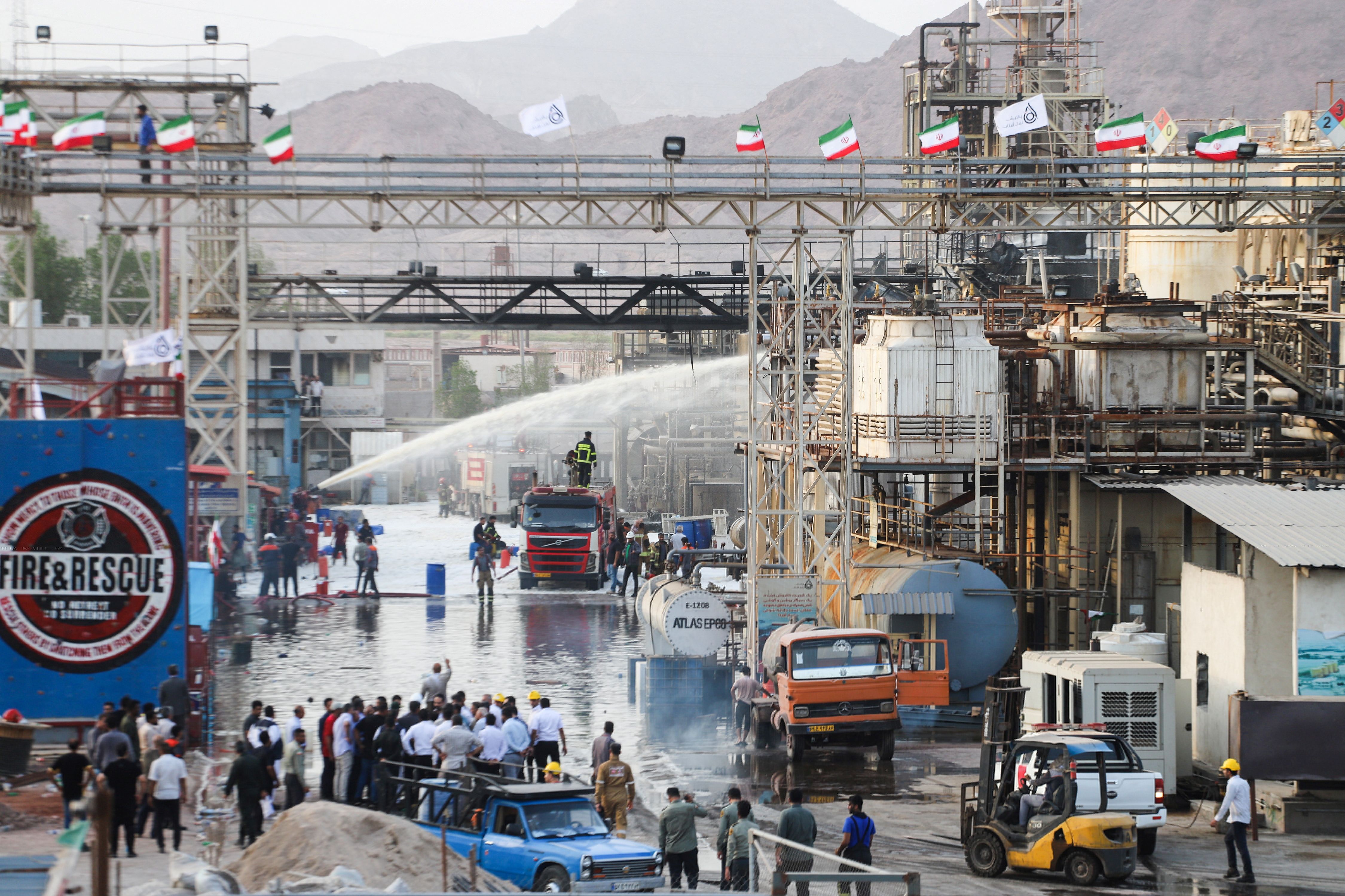 Firefighters put out a fire at an oil refinery in Bandar Abbas, Iran, July 10, 2023.