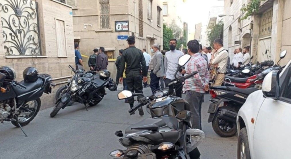 Agents and onlookers gathered around Khodaei's house on May 22, 2022