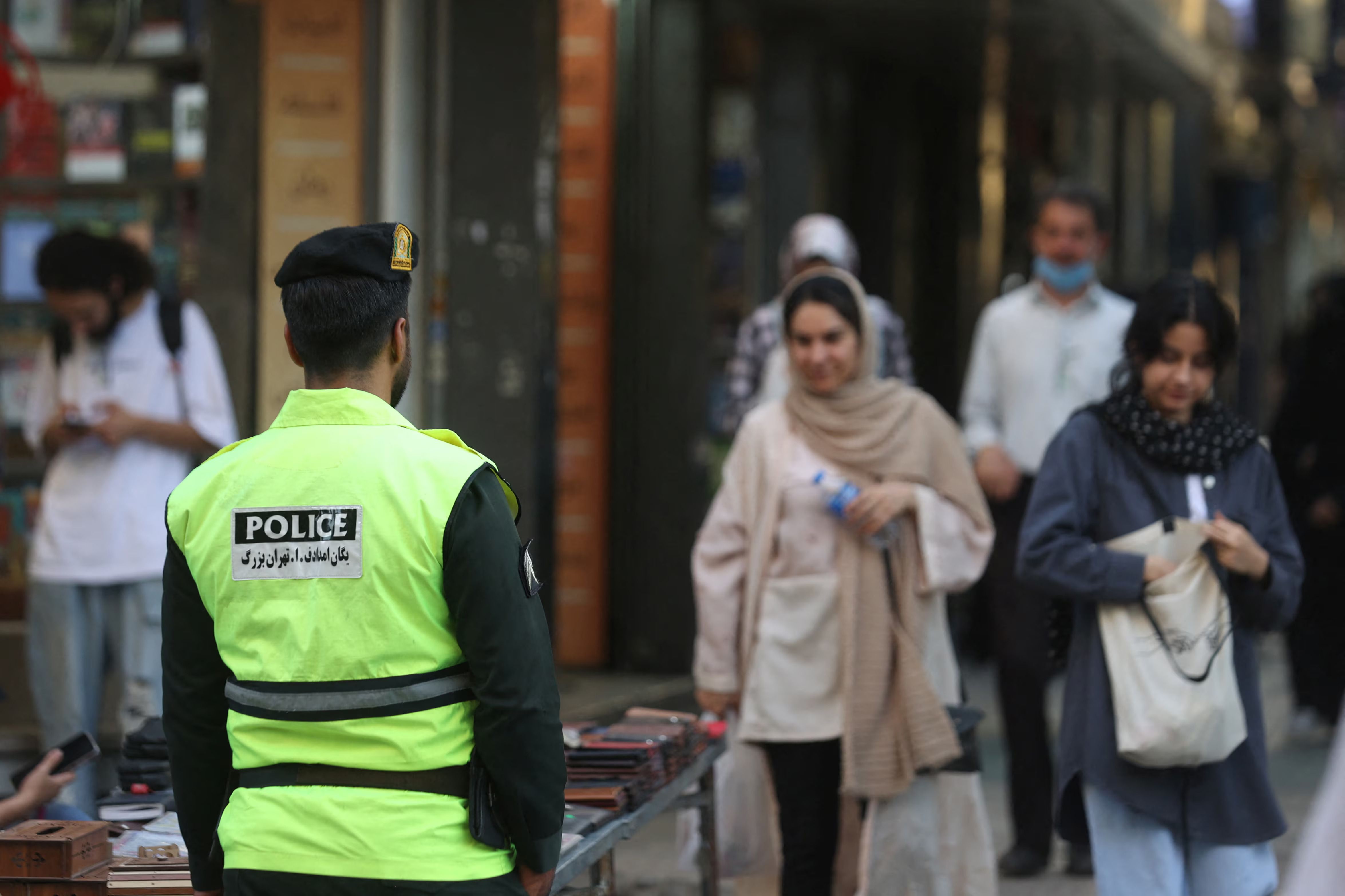 An Iranian police force stands on a street during the revival of morality police in Tehran, Iran, July 16, 2023.