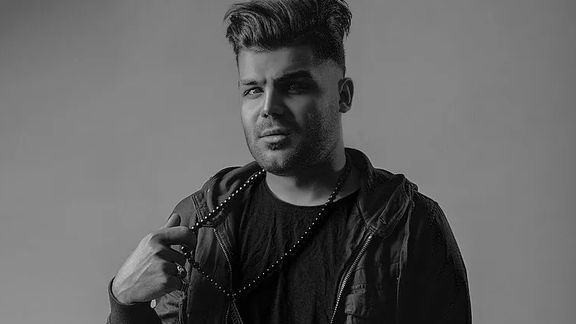 Dissident Iranian rapper sentenced to death arrives in Germany