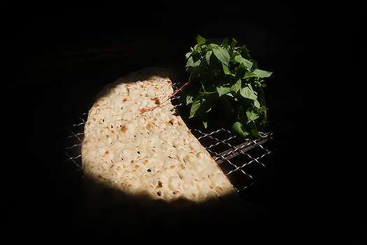 A traditional Iranian Sangak is left to cool down on a metal mesh table at a Tehran bakery (File photo)